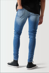 SKINNY SUSTAINABLE DISTRESSED JEANS - MID WASH